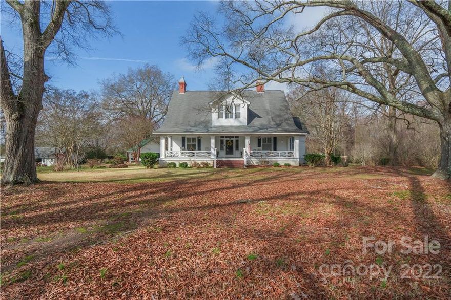 This two story farmhouse, built around the early 1900's, has stunning southern charm! Everything about this home is spacious, from the yard to the front porch to the tall ceilings inside. Inside are also beautiful hardwood floors and three functional gas log fireplaces. This well kept house has tons of storage and living space, bright rooms, and beautiful details throughout. Home is situated in a country setting on a sprawling 7+ acres  is the perfect escape from the city life!