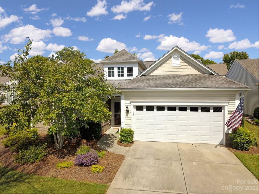 Looking for that 3 bed/ 2 bath + an office & a private backyard on one-level living? Here it is! This Vernon Hill model offers LVP in the main living areas for easy maintenance with the comfort of carpet in the bedrooms. Kitchen features SS appliances w/ a smooth glass-top electric range, granite counters w/tile backsplash, pantry, breakfast bar, & breakfast nook. Separate dining area for larger gatherings allows easy entertaining. The gas log fireplace is enjoyable during the cooler seasons and offers warm ambiance in the great room area. Primary suite w/ tray ceiling, & the bathroom has double vanities, glass shower, a garden tub, & a spacious walk-in closet. Secondary bedrooms share a convenient hall full bath. Slider doors lead to the wonderful, covered lanai with a ceiling fan overlooking a very private backyard space- the perfect place to relax & unwind in a serene setting! Fantastic opportunity to enjoy the resort style living and amenities of Sun City Carolina Lakes!