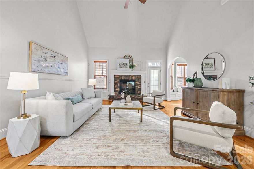 Motivated seller! Considering all offers! Stately 4 BR, 3 and 1/2 BA home in much sought-after water-front community, The Landing. Home exudes a warm and welcoming family ambiance with many unique, comfy nooks to explore and retreat to. Two stunning fireplaces, quality crafted tray ceilings, quaint built-ins, including cozy window seats, add to its charm. Beautiful Bay windows on both main and basement levels overlook the lush-wooded area surrounding this secluded home, with a large deck and walkout patio. Refined primary BR on main level also has a glorious view of the lush-green wooded backdrop of this home, as it sits on the same level as the back deck.  Stunning solid wood floors throughout main living areas, including the primary BR. Fully finished walkout basement with gorgeous stacked-stone wet bar boasting an elegant granite countertop. Perfect space for entertaining, playing around, or just relaxing with a billiards room, an additional living room, and 2nd breakfast nook or poker table area, and hideaway office or reading nook, including a full bathroom with walk-in shower. Upstairs features a generous bonus room with oversized walk-in closet.  Perfect as a 5th bedroom or another flex/living area.  Large stylish Jack and Jill style bath suite featuring 3 sinks.  Walk-in closets in 3 of the 4 BR's. Semi-enclosed and very private, moderate back yard space, great for entertaining or enjoying some gardening, minus the burden of extensive yardwork. A 2-car garage with additional room for a seated mower or golf cart, with 2nd boat-sized garage on lower level - perfect for a workshop, home gym, or indoor batting cage!  Community features picturesque walking trails, playground, gated pool, clubhouse, sidewalks, golf cart-friendly, and easy access to the lake - incredibly ideal for exercise, socializing, and rejuvenation. This home sits within the highly desirable Clover School District. Close to popular restaurants and shopping. Now exhale...You have found your way home!!!