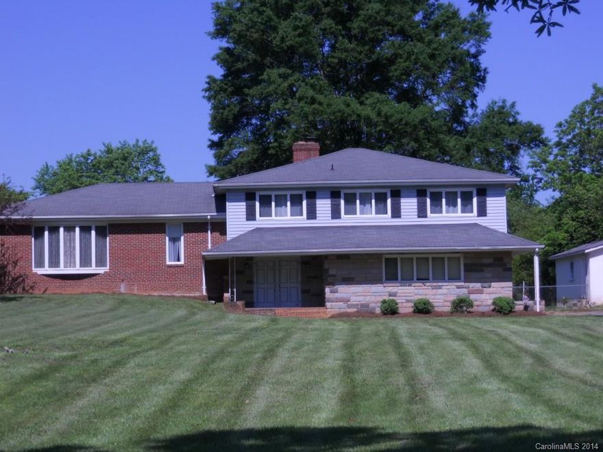 Although this huge home is older & in need of flooring, painting, and upgrades, the list price is well below tax value to anticipate these. At 1.5 acres, the lot allows space for gardening & the 2 car garage and separate out-building allow generous space for workshops. The lower level was once a home hair salon and has ample space for office or family recreation. All rooms/closets are extra large.