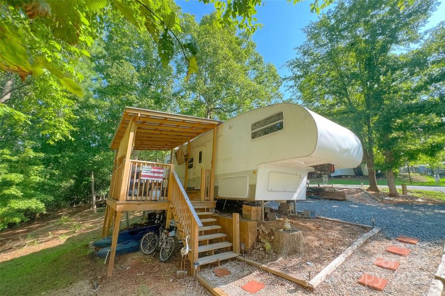 Welcome to 164 Larboard Trail #1B, a cozy 2-bedroom, 1-bath located in the gated Twin Harbor community on Lake Tillery. This home sits on a desirable corner lot and offers low-maintenance living perfect for a weekend getaway or a full-time retreat. It features a covered porch ideal for relaxing outdoors, central air and heat, and a functional kitchen equipped with a refrigerator, gas oven/range, and microwave. Twin Harbor is known for its exceptional amenities, including a private community beach, swimming pool, mini golf, arcade, tennis courts, playgrounds, picnic areas, pickleball court, basketball court, and boat and RV storage. Whether you're enjoying lake days or spending time with friends and family, this community has something for everyone. A $100 transfer fee is required per Twin Harbor. All potential buyers must be accompanied by a licensed REALTOR®. This is a fantastic opportunity to enjoy the lake lifestyle at an affordable price.

Roof was resealed 8/2025