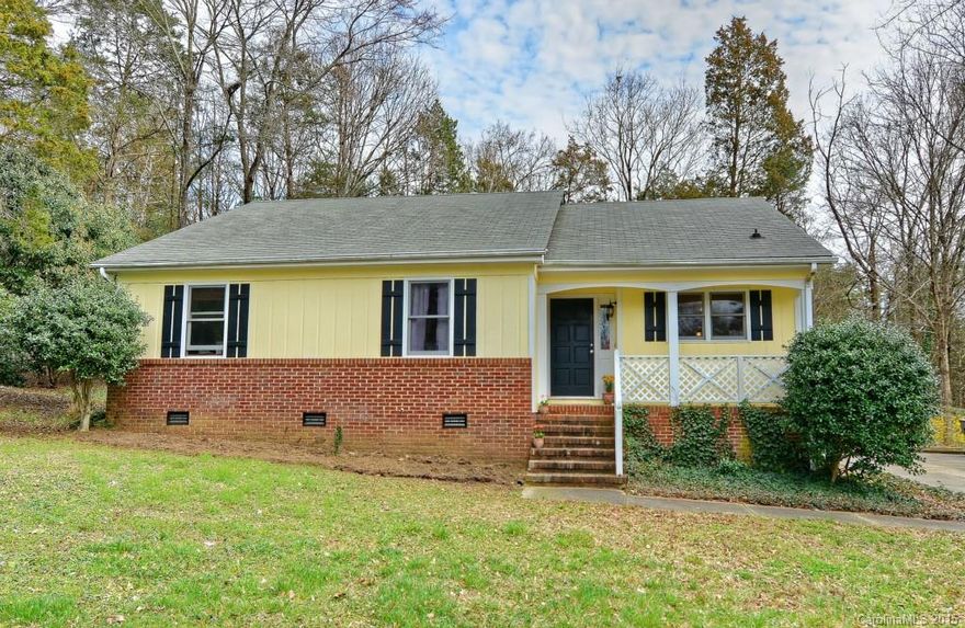 This is an adorable one story home in a quiet cul de sac off Carmel Road.     Bright open floor plan with vaulted great room. Almost an acre, nice wooded lot, so additions would work here.   NO HOA!   Cozy masonry fireplace, exposed beam ceiling, granite counter tops remodeled bathrooms.  newer light and plumbing fixtures.   Close to Ballantyne and Carolina Mall areas.