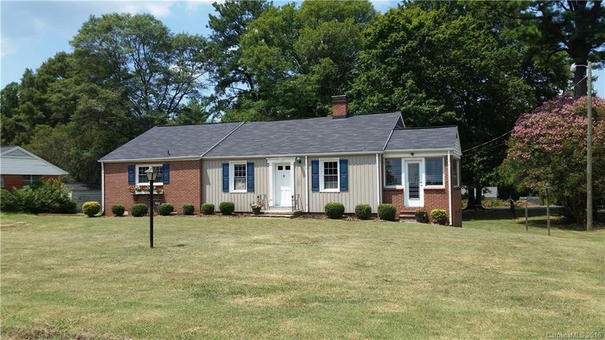 Beautiful,  move in ready 3 bedroom partial brick home with enclosed sunroom to relax in!  Spacious yard with  established trees. Gorgeous, brand new Kitchen with stainless  appliances, granite countertops, ceramic tile backsplash and new cabinets. Updated bathrooms with tiled flooring and refinished hardwood floors throughout. Newly added First floor laundry room. Partially finished basement with exterior access includes a half bath and laundry connections as well.