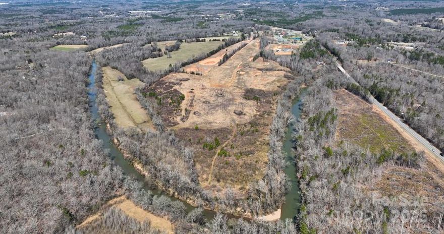 Discover a rare opportunity build an exclusive private estate or to shape a premier residential community in one of Concord’s most sought-after and fast-growing areas. This expansive ±70 acre property offers the perfect balance of seclusion, natural beauty, and accessibility. Tucked away in a peaceful, wooded setting, the land features scenic frontage along the Rocky River, providing a serene and picturesque backdrop, ideal for a thoughtfully planned neighborhood. Despite its quiet atmosphere, the property offers easy access to Highway 601, placing future residents just minutes from schools, shopping, dining, and major commuter routes. With gently rolling terrain, mature trees and riverfront vistas, the possibilities are endless. Whether you're envisioning a luxury gated enclave, estate-style homes, or a master-planned community that embraces and enhances the natural landscape, this is a blank canvas for your vision. Additional parcels available for a total of ±278 acres. Access is only available via a scheduled and approved showing.