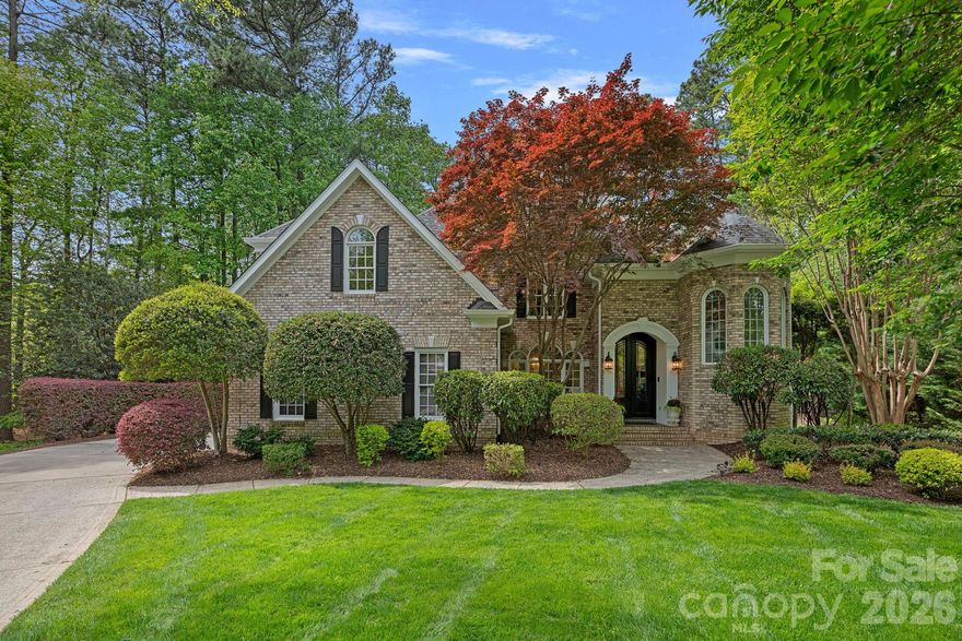 Tucked within the prestigious waterfront community of The Peninsula, this impeccably designed home offers a refined blend of timeless architecture and sophisticated, modern updates. From the moment you step through the arched double doors into the dramatic two-story foyer, every detail speaks to quality—rich hardwood floors, extensive millwork, designer lighting, and curated finishes that create a home as elegant as it is inviting. Designed for both elevated entertaining and everyday living, the main level unfolds beautifully with a richly appointed study, a stunning formal dining room, and a light-filled living room anchored by a gas fireplace and a wall of windows overlooking the backyard retreat. At the heart of the home, the chef’s kitchen is nothing short of showstopping—featuring a professional-grade refrigerator, gas range and dishwasher, and a microwave drawer—all seamlessly integrated with custom cabinetry, a large center island, and upscale finishes. The adjoining morning room offers a warm, sunlit space for dining and gathering, complete with a built-in bar and wine refrigerator. Upstairs, the home continues to impress with a spacious loft, secondary staircase, and a luxurious primary suite designed as a true retreat. Enjoy peaceful mornings or evenings from your private screened balcony overlooking the pool, along with a spa-inspired bath featuring dual vanities, a jetted tub, and an expansive multi-head shower. Thoughtfully designed secondary bedrooms, including an ensuite option, provide comfort and flexibility for family and guests alike. Outdoor living is equally exceptional, with a screened porch, a beautifully designed paver patio, and a private, fenced backyard surrounded by mature landscaping. The saltwater pool and spa with waterfall create a resort-style setting perfect for relaxing or entertaining, offering a seamless extension of the home’s elegant interior spaces. Life in The Peninsula is defined by both beauty and lifestyle, centered around a premier private country club and golf course, along with a vibrant waterfront setting on Lake Norman. Residents have the option to join The Peninsula Club, which offers championship golf, tennis, fitness, dining, and a dynamic social calendar (membership separate). Boating enthusiasts will also appreciate nearby Safe Harbor Peninsula Yacht Club, an upscale private marina and social destination with slips, dining, and events (membership separate).