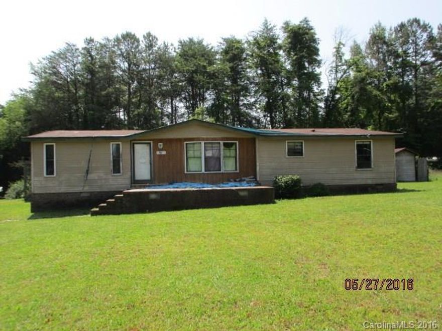 Manufactured doublewide home on a large 1.60 acre lot. Home features 3 bedrooms, 2 baths, kitchen and living room. Features include fireplace, porch, deck, 2 car detached carport, fenced yard, and in-ground pool.