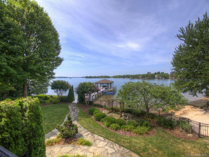 FABULOUS water views from this custom Simonini RANCH Basement estate. Master Suite on main w/ new carpet & heated tile floors, gourmet Kit with Wolfe/GE/Kitchen Aid stainless appliances new in 14'. Exercise Room w/ Sauna, tons of storage, 2 stone fireplaces. New Roof 14', 3 HVAC systems new in 12'. Lush landscaping provides privacy! Low maintenance Covered Dock w/ Boatlift, natural Sandy Beach w/ Fire Pit, fully Fenced Yard, In-Ground Pool w/ Hot Tub & lighting features. Beautiful sunset views!