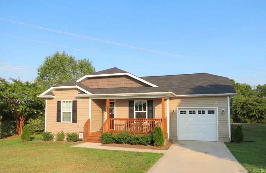 Great starter home as good as new.  3BR/2BA home with over 1100 sf.   Open and spacious with vaulted ceiling in living room.   Master bedroom with tray ceiling and walk-in closet.  Pantry in kitchen.  All appliances included.  Laundry room off of garage.  Neutral colors ready for your decorations.  Deck overlooking level back yard.  Beautiful landscaping.  Convenient location in town near shopping and dining.  Great home in price range.