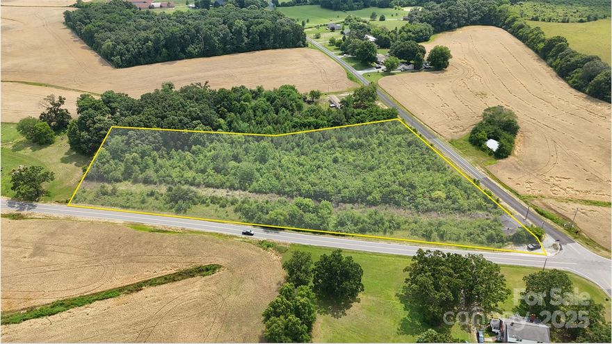 This ±5.72-acre parcel sits at the corner of Belk Mill Rd and Old Pageland Monroe Rd, offering excellent visibility and access. There is an old retail building on the corner conveyed at no value. Primarily zoned RA-40 with a corner section zoned B2 through Union County. This would be great for a private home site, or small development through subdividing within current zoning rules. Lot lines in pictures are approximate