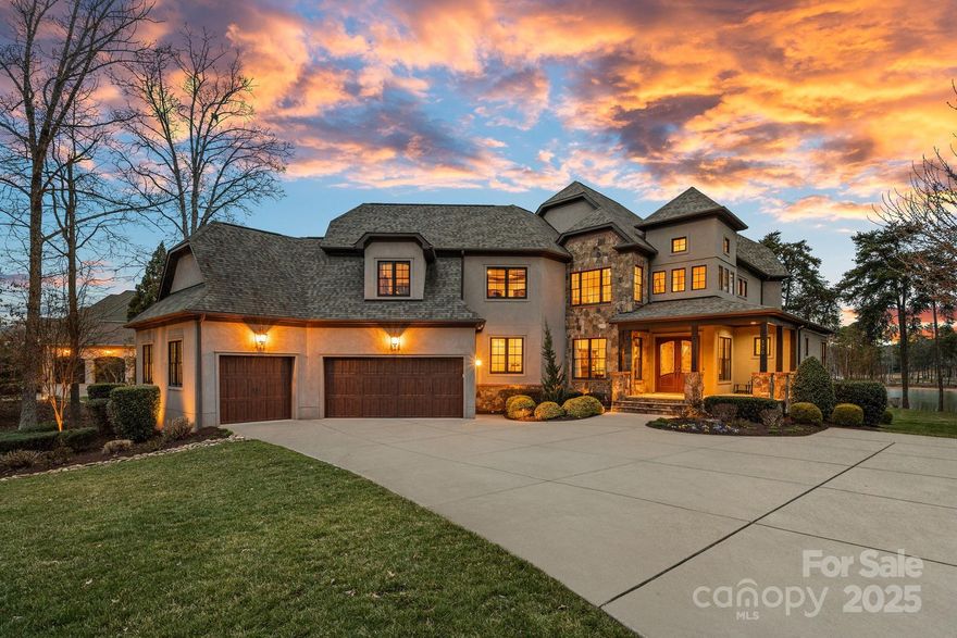 Exquisite waterfront living in The Point, offering breathtaking lake and sunset views. This 4-bedroom, 5.5-bathroom home, built in 2015, spans 5,744 sq. ft. and sits on 250+ feet of shoreline with a rare private beach. The private dock on a deep-water cove provides easy main channel access for enjoying Lake Norman.

With three levels of well-designed space, including a second-level bonus room, this home offers endless possibilities. A main-level flex room with a full bath is ideal as a guest suite or office. Expansive windows fill the home with natural light and stunning waterfront views. The lower level features a see-through fireplace, recreational space, bar, wine storage, and drop zone with full bath.

The outdoor space is impressive, with a screened-in porch, fire pit, and a spacious yard with room for a pool, all perfectly positioned for gorgeous sunset views.

Just a short walk from The Point’s world-class amenities, this home offers the best of luxury lakefront living.