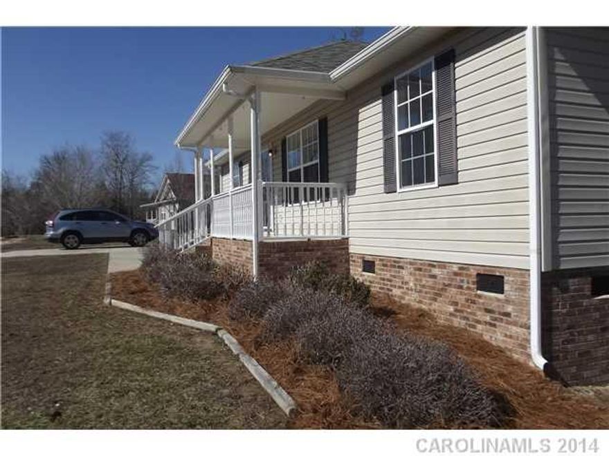 Everything you're looking for in this three bedroom home on a 2 acre lot.  Lots of upgrades including new hardwood laminate in the living room, new carpet in the bedrooms, new ceramic tile in the baths and freshly painted throughout.  All appliances with stove, microwave, refrigerator, washer and dryer.  Large wooded lot and workshop.  Hurry- this will not last!