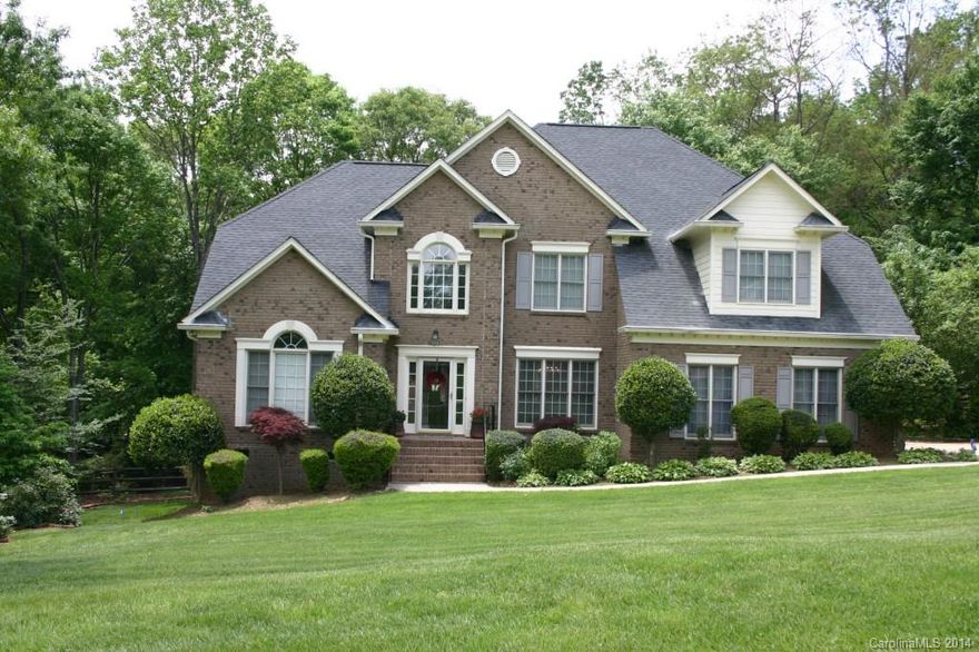 All Brick Beauty! Formal Living Room/Office/Music Room.  Spacious Dining Room.  2 Story Great Room with Gas Logs.  Great Room Opens to the Eat-in-Kitchen.  Great Room and Kitchen are Bright with Natural Light. Tons of Cabinet & Counter Space. 5 Bedrooms with the Master on the Main.  Master Bedroom has Door onto the Deck. 4 Bedrooms Up and a Huge Bonus Room.  Private, Fenced Back Yard.  Tankless Water Heater.  Swim/Tennis Community.