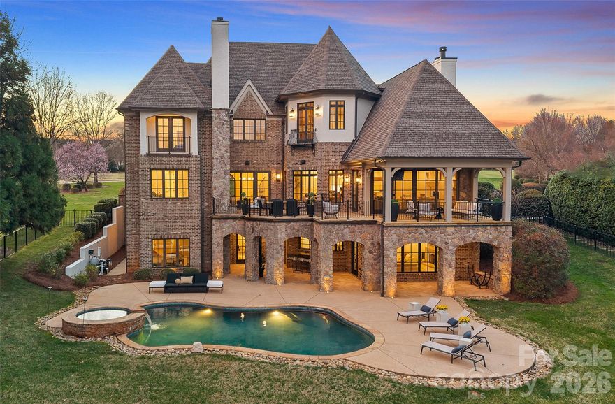 Witness the ultimate transformation of waterfront living in this four-bedroom estate that lives as a five-bedroom, all with en suites. Masterfully reconstructed by Cypress Builders in 2026, no original detail was left untouched in this premier estate. Located in a highly sought-after neighborhood at The Point, every inch of this property has been reimagined with high-end designer finishes by award winning Michelle McKoy Designs. The exterior sets a sophisticated tone with a fresh exterior palette, leading to a modern Optima iron double front door. The renovation integrated state-of-the-art systems throughout, including 2 NEW furnaces, NEW whole house humidifier, 2 NEW water heaters and more, ensuring the home functions as flawlessly as it looks. 

The main level is a masterclass in modern luxury, anchored by new 5-inch oak hardwood flooring and a grand staircase featuring modern iron balusters and a high end sputnik chandelier. The chef’s kitchen serves as the heart of the home, boasting floor-to-ceiling custom cabinetry, Taj Mahal Quartzite countertops with matching backsplash, and a massive white oak island anchored by chic global pendants. This culinary space is equipped with professional-grade Sub-Zero and Wolf appliances, including a commercial 48-inch gas range and a hidden Scullery featuring Miraggio Cove quartz counters, stylish floor to ceiling cabinets, an icemaker, beverage refrigerator and a second dishwasher. The open-concept flow continues into a surround-sound wired great room featuring illuminated white oak arched built-ins, a bespoke mantle surrounding the fireplace, and a stone-covered balcony offering sweeping lake views through large sliding doors. 

The primary wing is a private sanctuary, featuring a spacious suite with a Maxim LED ring chandelier and direct access to the exterior stone patio. A true retreat, the ensuite offers radiant heated tile floors, dual white oak vanities, and a palatial glass shower. A sleek soaking tub anchored by an artfully tiled feature wall creates a designer focal point, leading into a massive custom closet that features a private laundry area and is beautifully illuminated by a designer chandelier. Functionality meets style in the secondary spaces, including a dedicated dog wash room with stylish tile and a full drop zone area. 

The upper level expands the living space with three additional ensuite bedrooms—each featuring stylish lighting, custom vanities and curated tile work—alongside a media room and an upper-level laundry suite. This media room is professionally wired with full surround sound speakers and features a leathered granite wet bar and beverage refrigerator for effortless entertaining. 

The lake level is designed for high-end entertaining, featuring a lounge that leads to an executive office clad in custom walnut paneling and an aged brass Sputnik lighting fixture. The heart of this level is a massive, open-concept space that seamlessly integrates a billiard area, a wine room, and a family room wired for surround sound with a modern gas fireplace. Serving this entire area is a secondary kitchen with Miraggio Cove quartz counters, custom cabinetry, and stainless appliances including a beverage fridge, ice maker, dishwasher, and microwave drawer. A serving window and door provide easy access to the covered patio and pool deck. Completing the lake level is a flex space/guest suite offering lake views, a walk-in closet, and a full bath with a herringbone-tiled shower and frameless glass door. Two expansive storage areas provide ample space for lakeside essentials. 

The transition to the outdoors is seamless, leading to a massive patio with a heated inground pool and spa with new equipment and flagstone coping. The property’s lakeside amenities are unparalleled, featuring a private composite dock with a seating area, boat lift, dual jet ski ramps, and a stacked stone seawall with a lakeside fire pit, all situated on a wide, picturesque cove.