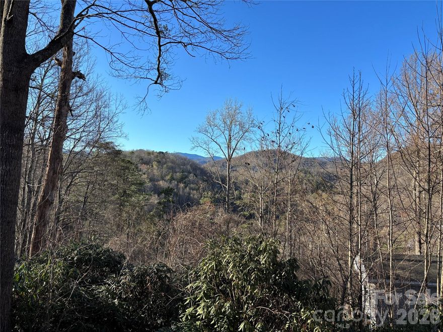 MOTIVATED SELLER! A DIAMOND IN THE RUFF!!! Located in the historic town of Old Fort, this property which borders Mill Creek is within walking distance to restaurants, shops, church, and school.  Spectacular views!!!
Old Fort-nestled in the foothills of the Blue Ridge Mountains offers family friendly atmosphere.  Easy access to I-40...20 minutes to Lake James; 30 minutes to Asheville; 30 minutes to Morganton; 2 hours to Charlotte.  Peaceful, quiet neighborhood, Old Fort offers hiking, biking, fishing and more.  Relax and enjoy the serenity of this conveniently located acreage. This property is just waiting for you to put your personal stamp on it and make it your own- filled with laughter, good times and home cooked meals.  
There is a single wide trailer on the property that is at present not live able- (not recommended you enter) - but according to the seller can be repaired and made live able.  There is also a 10x12 storage shed with shelving. Bring an offer!!!!