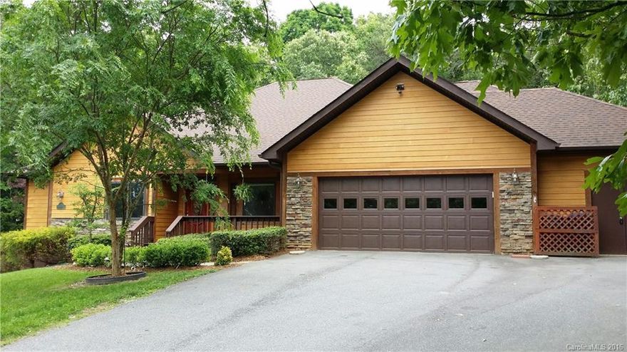 This spacious home has lots of living on one level including two master suites, bonus room, office & heated shop. Great room which opens to the kitchen has beautiful vaulted wood ceilings & overlooks gazebo & small pond in back yard. Large master suite has tray ceiling & skylight. Screened in back porch. Additional lower level rec room & bathroom. Just 9 minutes from I-240 in Asheville But no city taxes! In the mature Kirk Glen neighborhood on .8 acres. Short walk to Stoney Knob restaurant.