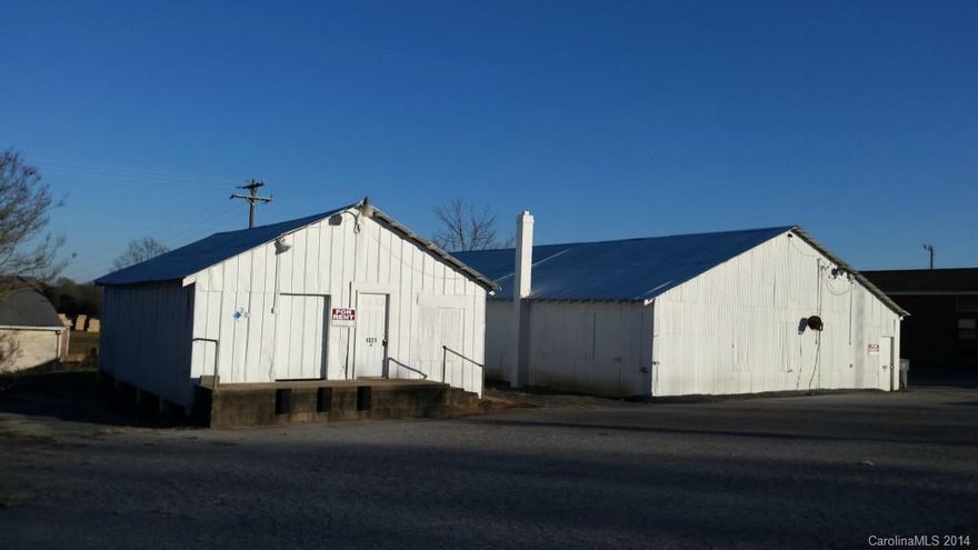 OWNER FINANCING AVAILABLE on this visible .66 acre corner lot with improvements. Buildings include a 24'x40' frame warehouse with concrete loading dock and a 40'x100' partitioned workshop/storage building with garage doors. Conveniently located to Statesville and Hickory via I-40