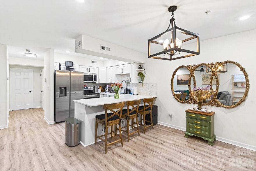 Welcome home to Locke Mill Plaza—a character-rich, historic mill conversion with a modern edge, just minutes to the energy of Downtown Concord. This 2-bedroom, 1-bath condo blends timeless charm with the upgrades that matter: fresh interior paint, new LVP flooring in the bedrooms, and a water heater (~2 years old). Plus, the sellers will be adding new blinds in both bedrooms before closing.

The kitchen is the star here—bright, clean, and confidently updated with white shaker cabinetry, matte black hardware, stainless appliances, a statement apron-front sink, and a soft neutral mosaic backsplash that ties everything together. And the hookup and plumbing are already in place for a dishwasher, making it easy to add one if you want. The open flow into the living area makes it perfect for entertaining, relaxing, or keeping your everyday routine feeling simple and connected.

Both bedrooms are set up to feel like true retreats, with new LVP flooring for a fresh, cohesive look. The primary bedroom offers a comfortable space to unwind, while the second bedroom gives you options: use it as a traditional bedroom, a guest suite, a dedicated home office, a workout/yoga room, a nursery, or a hobby/creative space—whatever fits your lifestyle right now.

The bathroom continues the clean, refreshed feel with bright finishes that keep the space feeling polished and crisp.

You’ll also love the convenience of the in-unit laundry closet, keeping everything you need right at home.

Beyond the unit, Locke Mill Plaza delivers community perks that make daily life even better: enjoy sunny weekends at the community pool, take advantage of the picnic area for grilling or gathering with friends, and appreciate the added peace of mind with gated parking plus controlled/gated building access.

And the location is the real win: you’re minutes from Downtown Concord’s restaurants, breweries, coffee shops, parks, and year-round events. Whether you’re grabbing dinner, meeting friends for brunch, or heading out for a festival, this home supports a walkable, lock-and-leave lifestyle—historic character, modern upgrades, and downtown convenience all in one.