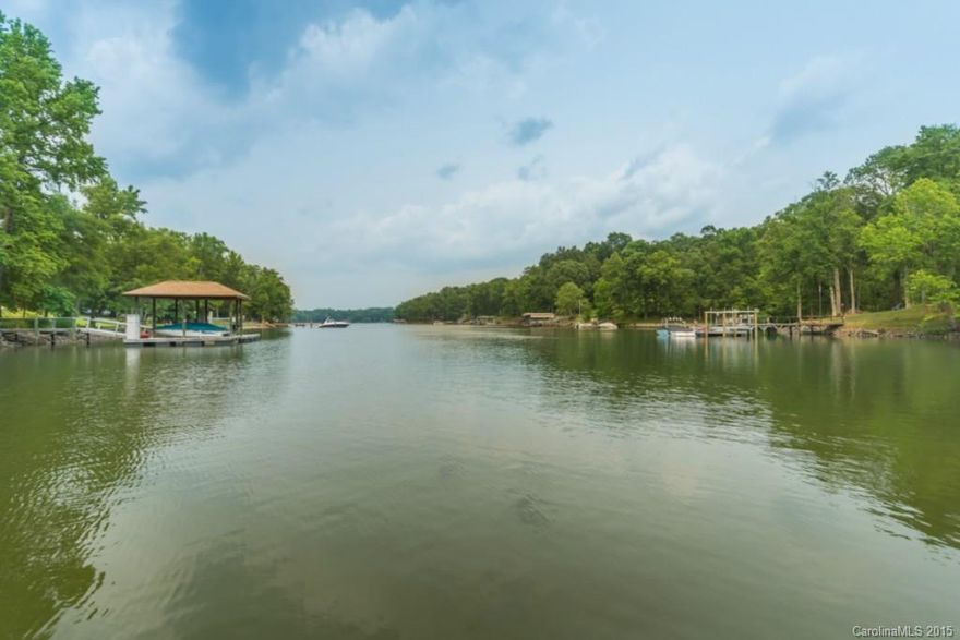 UNBELIEVABLE NEW PRICE...! Magnificent Lake Wylie Waterfront Home with a Salt Water Pool, Pool House with Kitchen, FP and 1/2 bath, Home has 4 BR, 3 1/2 Half Baths, Exceptional Guest Suite with full bath!  All Located on a Grand Secluded 1.33 Acre Waterfront Retreat.  This Immaculate Home Reflects a Manicured Lawn, White Sandy Beach, Gated Entrance/Fenced Yard, Two Piers, Two Story Great Room with Incredible Water Views. Huge Gourmet Kitchen w/Granite Counter Tops. Master on Main w/Jacuzzi w/p.