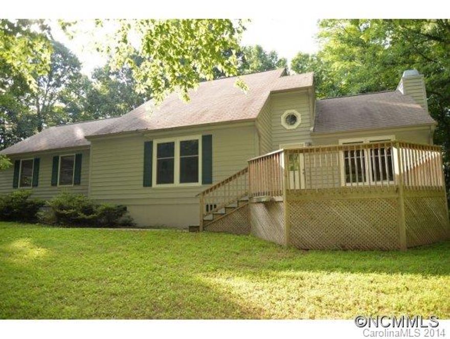 Contemporary style home with two decks on 1.94 acres.  Open kitchen and dining area leads to great room with cathedral ceilings and rock fireplace with gas logs. Master on main level. 4th room with closet could be used as bedroom/office. New  insulated windows installed in 2014 excluding garage. Entire exterior was painted in 2013. Seller to provide $3000 carpet allowance.  Short drive to Brevard, Hendersonville and airport area.