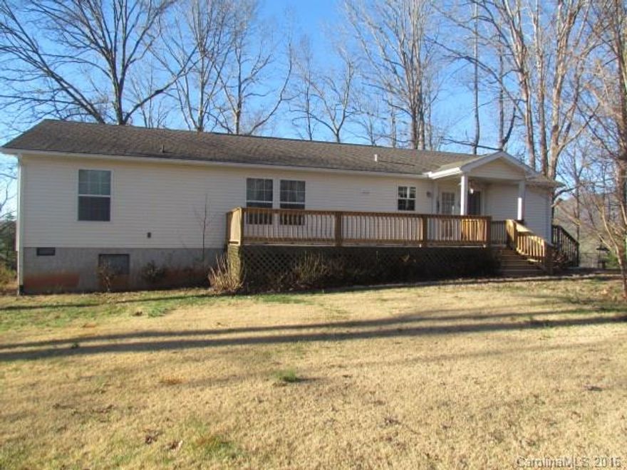 Home in Mill Spring on knoll with views of White Oak Mountain.  Well maintained newer home on 1.72 acres with 3 bedrooms/2baths. Home features split bedroom plan, large walk-in closets, dbl sinks in master w/ garden tub. Kitchen island, pantry, large laundry room and utility storage. New deck off the back of house, big carport  and other outbuildings. Great location off Hwy 9 between 108 and 74. Good value this one won't last long!