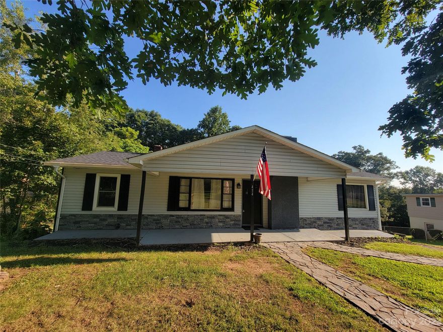 Come visit this gem of a property in Lenoir where the grass is green and the neighborhood is quite. Lots of updates in this 3 bedroom 2 full bath house, including recessed lights, new ceiling fans, and freshly painted walls.  The primary bedroom has a full bathroom overlooking the backyard. The kitchen has window doors to walk out on the new back deck to view over the  private yard. The refrigerator is included.  A detached 2 car garage is set off to the side. There is a new roof and HVAC installed.  Tons of potential in this home with an unfinished basement. Book your showing today!