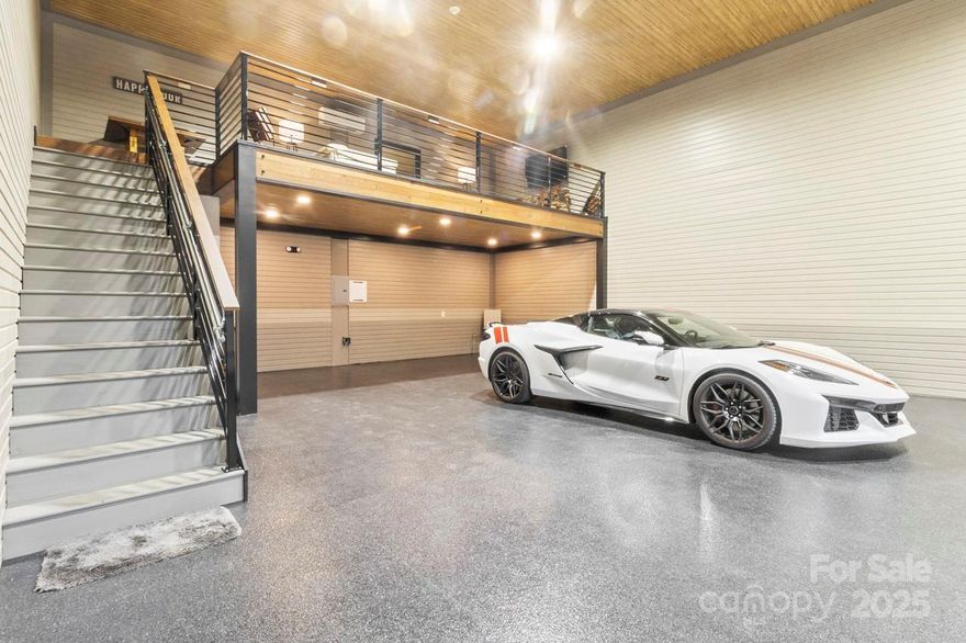 Discover an exceptional opportunity at The Garages at LKN—Mooresville’s premier destination for luxury storage, small business operations, passion projects, and personal retreat spaces. This newly finished 1,500 sq ft unit offers an upgraded, turnkey environment featuring a fully finished mezzanine ideal for a lounge, office, creative studio, or client meeting area. The main level provides expansive, climate-controlled space perfect for storing high-end vehicles, recreational equipment, or operating a boutique business. Quality finishes, upgraded lighting, and a beautifully crafted staircase lead to the upper mezzanine, where warm wood accents, modern railings, premium flooring, and ample seating areas create an inviting second-story hangout or workspace.
One standout feature of The Garages at LKN is the exclusive community clubhouse, available only to owners within the complex. This amenity includes a conference room, lounge spaces, and a snack bar, offering an elevated experience rarely seen in commercial storage or flex-use developments.
Whether used for car collection, personal storage, entertainment, or a small business needing a polished and private setting, this unit delivers unparalleled versatility with style. The owner’s thoughtful upfit ensures the space is move-in ready and designed for both functionality and enjoyment.
A rare chance to own a highly desirable, amenity-rich commercial unit in one of Lake Norman’s most dynamic and fast-growing areas.