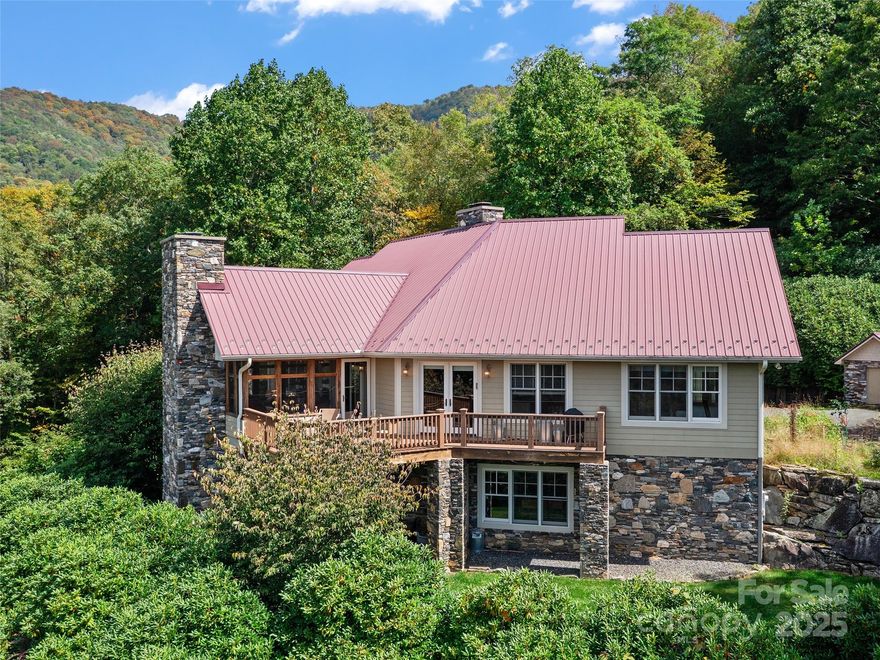 Nestled beneath the stunning Roan Mountain, this one-of-a-kind property offers space, charm, and versatility for the whole family and all your animals. The main home features 3 bedrooms, 2 baths, and a screened sunroom with a striking stone fireplace crafted from rocks gathered on the property. Also included is a beautifully updated 1920s homeplace full of character, plus a cozy bunkhouse perfect for guests or rental potential. The land is equally impressive with ample fenced pasture, barns, pig pens, and equipment sheds, making it ideal for farming, livestock, or simply enjoying wide-open space. Whether you’re looking for a private homestead, an income-producing opportunity, or a mountain retreat, this property delivers it all. Truly a must-see to appreciate the beauty, history, and potential waiting here.