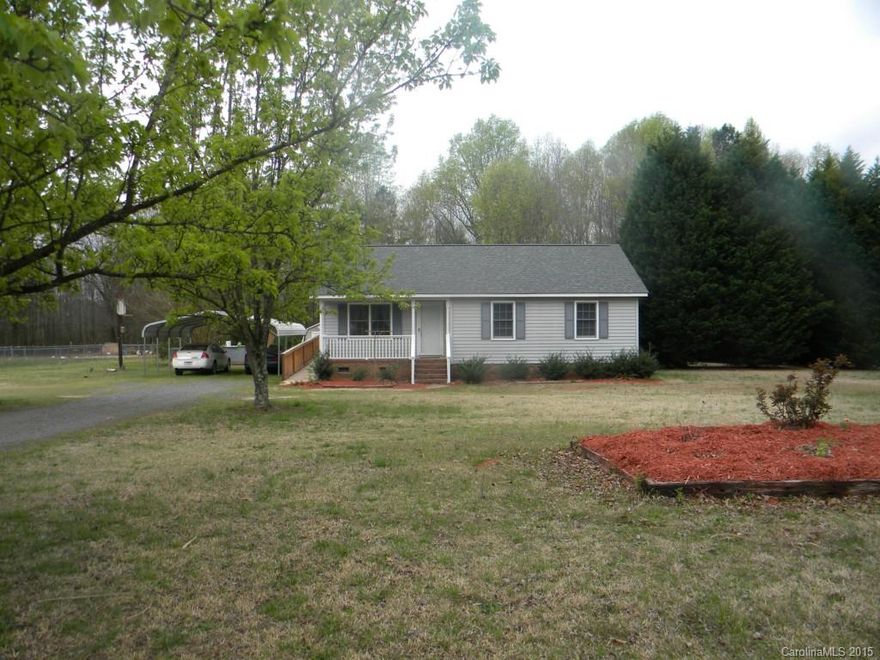 Cute,Cute Cute!!! Wonderful country setting on large 1 acre lot with covered rocking chair front porch, large deck in back with view to private wooded backyard perfect for outdoor entertaining, open and airy floor plan, Mstr. Bedroom with walk-in closet and private bath. NEW roof in Jan. 2015, NEW HVAC in Sept. 2014, NEW deck and ramp (wheelchair accessible) vaulted living room, JUST painted inside and out with neutral color, wonderful backyard storage shed and 2 car carport.  READY TO MOVE IN!