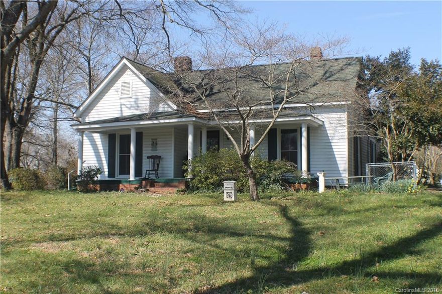 Enjoy warm summer days relaxing on this rocking chair front porch w/lg shade trees. This CHARMING OLD STYLE FARMHOUSE was built circa 1880 and will surely take you back in time! Home boast high ceilings, original bead board on walls & ceilings, original moldings & trim throughout w/a wide center hallway, original hardwood floors. Partial unfinished basement. Home is in move-in condition, can use a little TLC. SOLD AS IS. Only minutes to Ballantyne, Fort Mill and 10 min from Carolina Place Mall.