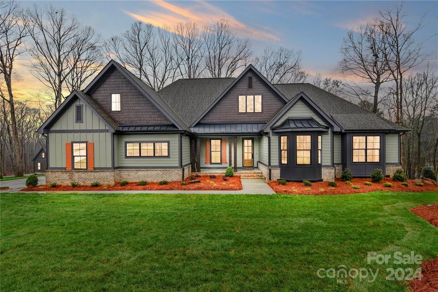 The builder is offering a 2/1 Buy Down on the property!

Stunning custom estate on 2 acres, featuring exquisite molding, hardwoods, tile, carpet, 4 bedrooms and 4 full baths.  Enjoy the spacious family room with a cozy gas fire fireplace, an open floor plan, and a large chef's kitchen with a generous dining area. The custom cabinetry and over sized island is perfect for entertaining. The primary suite boasts grandeur, complemented by a gorgeous en-suite with an oversized shower and soaking tub.  Additional highlights include a sizable laundry, pantry, and office. Two bedrooms downstairs provide ample space, while the large covered back porch with a wood-burning fireplace is perfect for outdoor gatherings. Upstairs, a huge flex/bedroom awaits, complete with a private full bath. Revel in the charm of a front porch and the privacy of the expansive 2-acre lot with gorgeous landscaping.
Your dream home awaits!