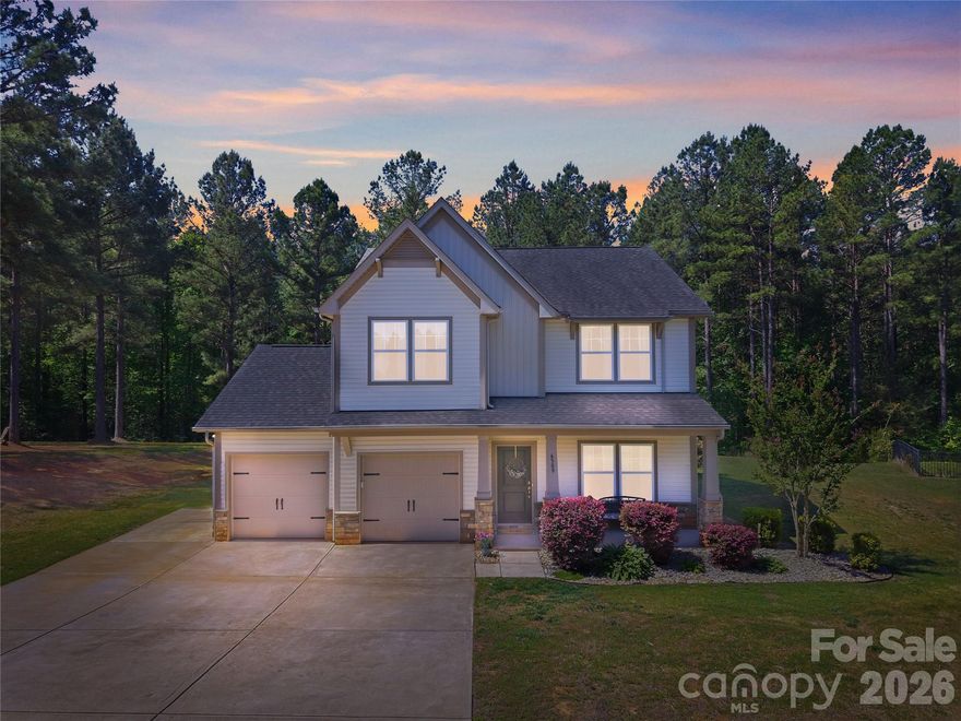 Tucked away in the tranquil Conservancy at Waxhaw Creek, this beautifully maintained 3-bedroom, 2.5-bath home offers the perfect blend of privacy, space, and convenience—just minutes from the charming shops and dining of downtown Waxhaw. Situated on a premium cul-de-sac lot backing to a protected treed area, you’ll enjoy 1.2 acres of peaceful surroundings and room to breathe.

Inside, the thoughtfully designed floor plan features a dedicated first-floor study and a spacious second-floor loft, providing flexible additional living space for work, play, or relaxation. The chef’s kitchen is a true standout, boasting abundant cabinetry, generous granite counter space, and room to gather. Cozy up by the wood-burning fireplace and enjoy the home’s warm, inviting feel.

The expansive owner’s suite offers a luxurious retreat with a stunning custom California closet and a spa-like shower featuring floor-to-ceiling tile.

Step outside to your private backyard oasis—complete with a fenced yard area for pets or play, a spacious patio for entertaining, and a separate fire pit area nestled among the trees for relaxing evenings under the stars. With a relaxed HOA, even chickens are welcome!

Additional highlights include an oversized tandem garage and extended driveway, offering plenty of parking and storage.

This is the peaceful escape you’ve been waiting for—come fall in love.