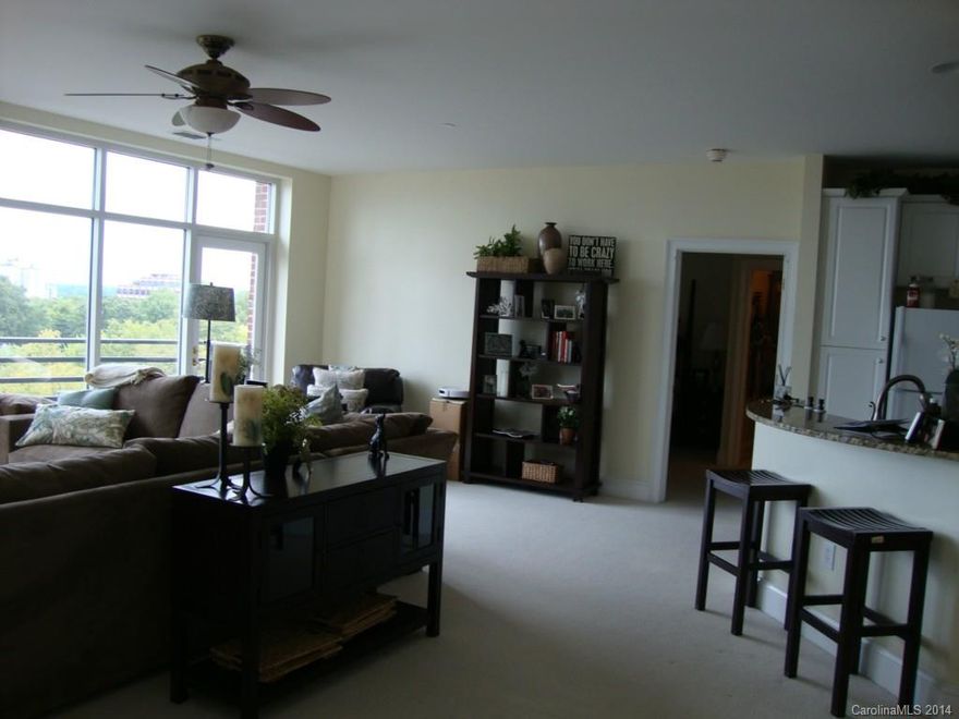 Spacious 2 BR, 2 BA condo with open split floor plan. Granite countertops. Large balcony overlooks Fourth Ward. Fitness center. Secured building with secured parking. Just a short walk to all that uptown has to offer. Storage unit. 1 parking space.