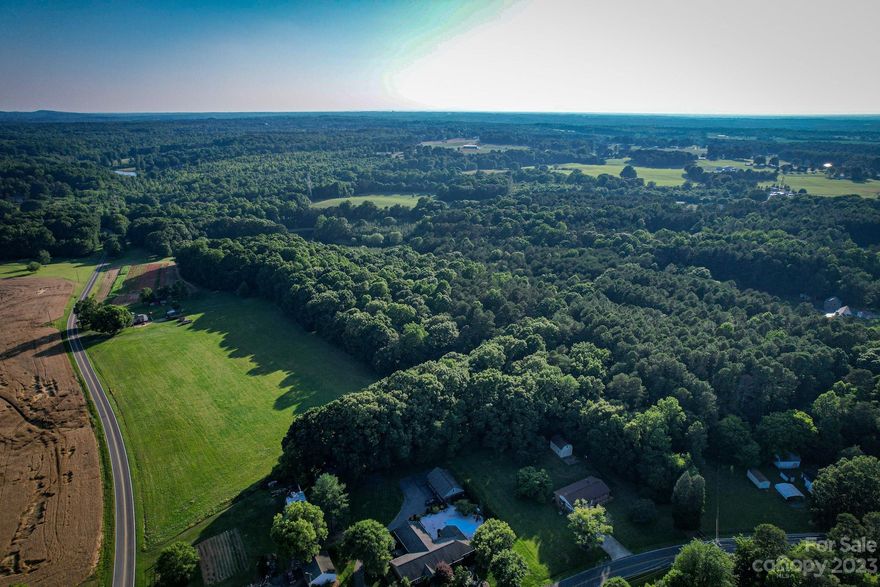 Beautiful acreage for sale in Catawba, NC. This property is mostly wooded with a large cleared pasture and is approximately 1 mile from Lake Norman! The topography is gently rolling with plenty of level green area. Located just outside of Catawba city limits, this property consists of 4 parcels that will total 31.68+/- acres once combined. Seller will provide an updated survey prior to settlement. Property is just a short drive from I-77 & I-40, making it convenient to Catawba, Mooresville, Statesville & Hickory! Public Boat/Lake access is less than 5 minutes away at the Long Island Road Boat Ramp. Land is ideal for agricultural uses or residential development, i.e. mini farms, private estates, family compound, etc.). Contact Listing Agent for more details!