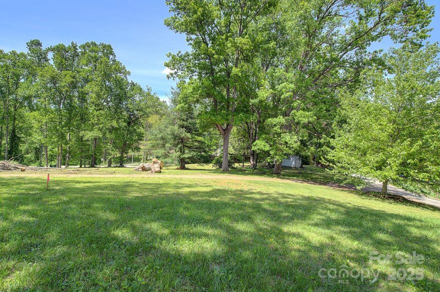 Seize the chance to build in one of Asheville's most desirable areas. This nearly one-acre parcel, approved for subdivision into two lots, offers unmatched versatility thanks to its Open Use zoning. Whether you're envisioning single-family homes, multi-family units, or short-term rentals, this property provides a rare blend of flexibility and convenience. This property is level, easy to build on and can capture some beautiful views of the Blue Ridge Mountains. 

Strategic Location: Just minutes from South Asheville's popular shopping, dining, parks, and hiking trails. 
City Water and Road Frontage: Essential utilities already in place, reducing build time and costs. 
Septic Ready: Already assessed for septic systems, simplifying the path to breaking ground.  
This is a rare opportunity to craft something truly special in one of Asheville’s most sought-after areas. Whether you're a developer, investor, or builder, this land is ready to bring your vision to life.