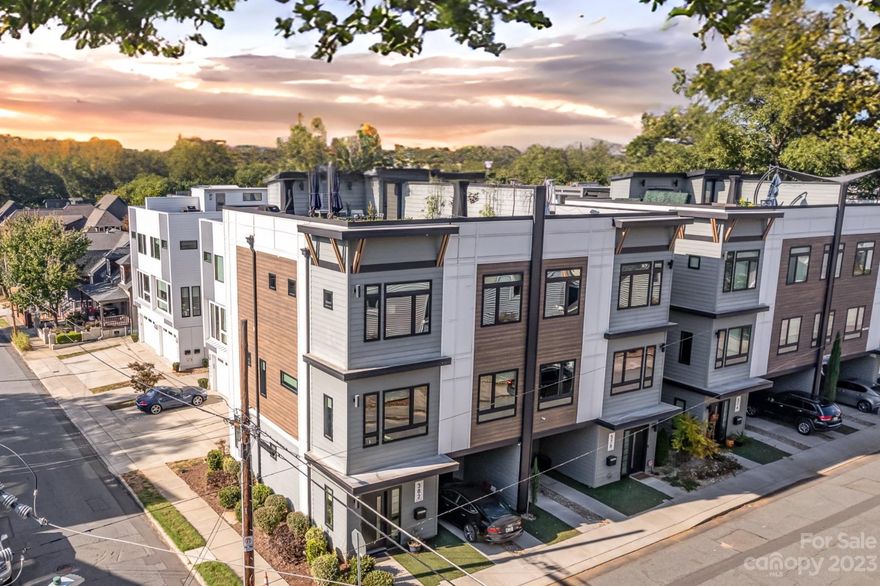 Experience luxury living at its best in this impeccably maintained 3-story townhome, in sought-after GreenLeaf Terrace Third Ward. This desirable end unit boasts abundant natural light, providing great views and a warm, inviting atmosphere. The high-end finishes, quartz countertops, and well-appointed lighting showcase the impeccable attention to detail. With three bedrooms, two boasting an en suite bathroom, and a total of 3.5 baths, privacy and opulence are paramount. Plus, the convenience of a private attached garage with additional covered parking ensures a seamless urban lifestyle. Unwind on the rooftop's lush turf-covered terrace, where you can savor the sweeping 360-degree Uptown vistas. Convenient access to commercial office space, restaurants, retail as well as sporting events and shows at Bank of America stadium or Spectrum arena. Don't miss this must-see townhome that offers the perfect blend of style, convenience, and luxury – schedule your viewing today!