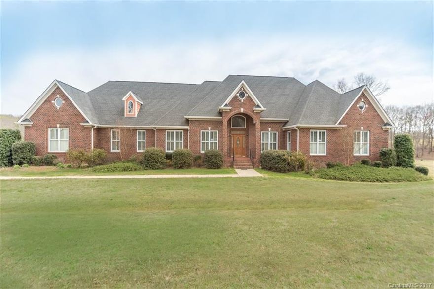 Beautiful full brick ranch on 5+ acres, minutes from Lake Wylie area. Formal living & dining. Office space. Hardwood floors through main living areas, carpet in bedrooms. Kitchen has stainless appliances, large breakfast area, bar area and work island. Family room has fireplace and built-ins. Master suite has trey ceiling, walk-in closet. Giant laundry room with built-in cabinetry. Oversized 3 car garage with workshop. Yard is fenced. Pond views. Clover School district and low SC taxes.