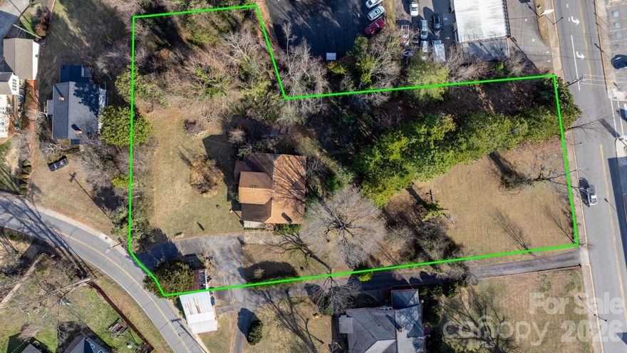 1.46± acre commercial parcel in downtown Valdese with Main Street frontage and B-1/B-2 zoning. Existing two-story structure on site with prior fire damage; structure is not currently habitable and is being sold as-is. Suitable for redevelopment or other permitted commercial uses (buyer to verify). City water and sewer available. Buyer to verify all information including zoning, condition, and intended use.