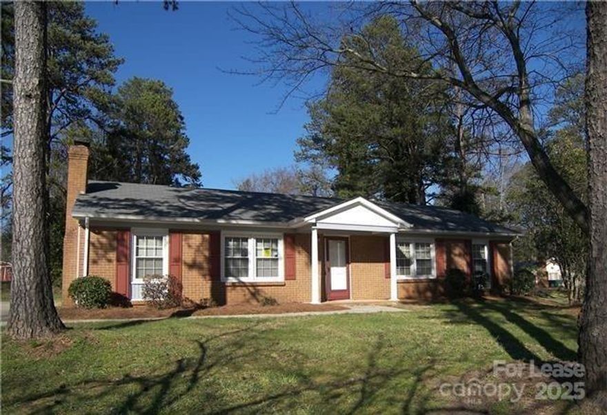 Lovely corner lot with a classic brick ranch in front, and maintenance-free vinyl in back. Great room, formal dining area, and eat-in kitchen. White brick fireplace. Some upgraded light fixtures. A beautiful tile shower surrounds in master bath. Large storage shed. Three bedrooms, and two baths with tile plank flooring in the living, family, and dining. A fence was recently added to the property. The property allows easy access to Uptown, the University area, Plaza Midwood, and the Noda area. A Must See!!!