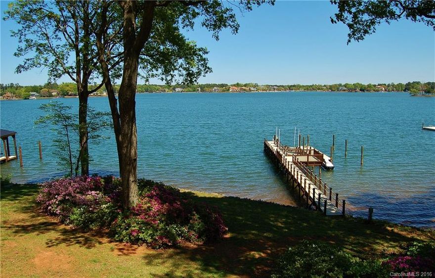 Spectacular Lake Norman estate setting in the premier upper Jetton Peninsula area. Featuring 170+/- ft of shoreline & wide year-round views. Cape Cod style home with daylight basement & 3 car garage. Fantastic renovation potential or perfect opportunity for a magnificent custom designed home. Private pier has sitting area, remote controlled 12k lb boat lift & jet ski float over deep water along with beach access. A rare gem property amid multi-million dollar upscale homes nearby Charlotte.