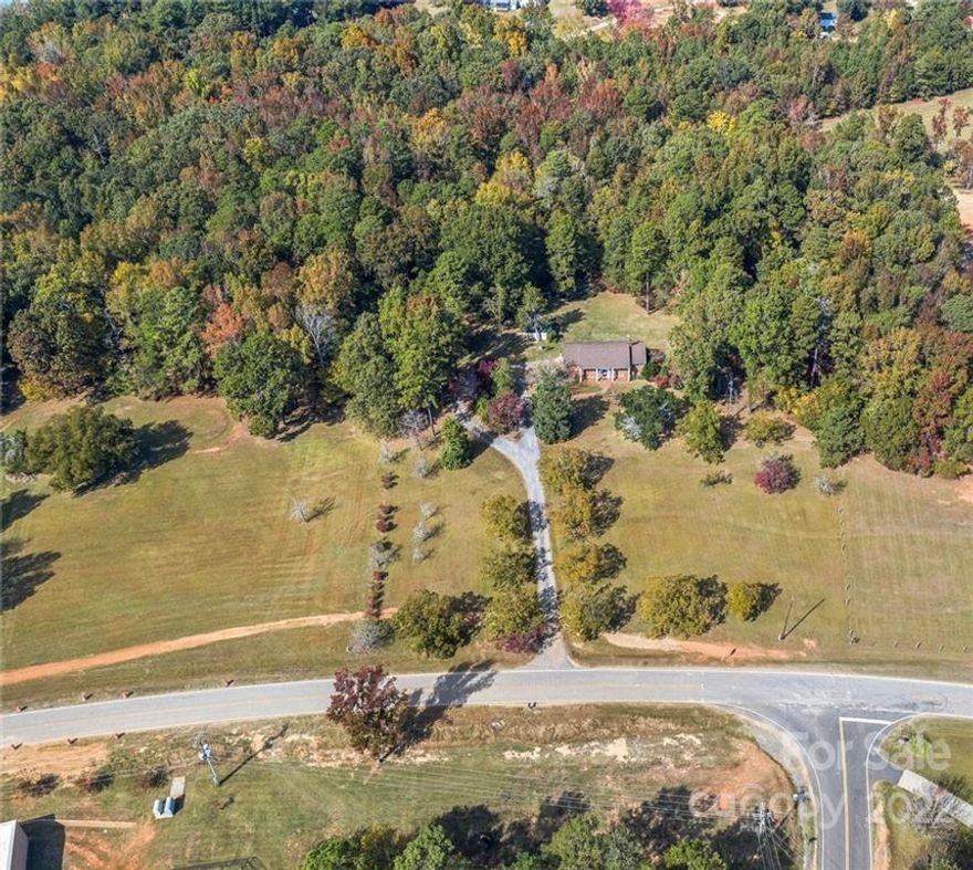 Stately Southern Home sits beautifully off road with grand entrance lined in pecan and magnolia trees. All brick home features Old Charleston brick walkway and covered front porch. With 5 Bedrooms, 3 FULL Baths, 2-car Oversized attached Garage and 2 wood-burning Fireplaces, there is plenty of room for family and entertaining.  The level acreage has mature camellias, azaleas, gardenias, fruit trees and blueberries. Convenient cul-de-sac driveway and shed for extra storage. Roof replaced with architectural shingles in 2010. Huge Garage is perfect for shop-work at 675 SQFT. There is also a detached shed for more storage. Award-winning Buford schools. No septic records on file, the Home has 3 bedrooms on main level and 2 bedrooms on lower level. Driveway close to Smokey Starnes Road. Home and Property SOLD AS-IS, seller has not lived in home.