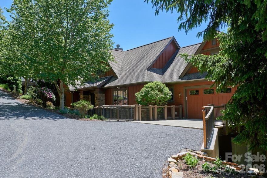 This impressive 5BR/4BA home is offered fully furnished and located in the highly desirable Spring Rock neighborhood. Perched at nearly 4,000’ elevation, Spring Rock is known for offering some of the most breathtaking sunset views on the mountain! You'll enjoy mountain vistas, spectacular sunsets, and the peaceful beauty of the protected Old Growth Forest — creating a serene setting unlike any other!

Beautifully maintained and updated, the home features an open-concept great room with stone fireplace, soaring ceilings, and gorgeous hardwood floors throughout. The spacious kitchen is equipped with new SS appliances, while the oversized island provides ample space for cooking, gathering, and entertaining.

The main level includes a luxurious primary suite complete with his-and-her closets, an updated en-suite bath with glass-enclosed shower, heated tile floors and a built-in beauty station. A second bedroom and conveniently located laundry room with added sink are also found on the main level.

Downstairs offers three oversized guest bedrooms — two with en-suite baths — along with a spacious family room that opens to a covered deck, perfect for enjoying cool mountain breezes and sweeping mountain views! The newly added third oversized bedroom features high ceilings, luxury vinyl plank flooring, a large closet, additional storage closet and direct access to the 538 sqft workshop. The spacious workshop includes an exterior steel-enforced door for additional ingress/egress and a stone walkway providing easy access to the main level.

Expansive deck spaces on both levels create the ideal setting for outdoor entertaining, relaxing, and taking in the surrounding natural beauty. The main-level deck features a cozy gas-log fireplace — perfect for enjoying cool mountain evenings while soaking in the breathtaking views. Additional highlights include window treatments throughout, a spacious two-car garage with epoxy-finished floors and driveway, and fresh exterior paint.

Set within our exclusive gated community featuring 24/7 manned guard gate.  All residents enjoy access to 6+ miles of hiking trails, 7 parks, and the highest elevation runway east of the Mississippi. Additional on-site amenities at Mountain Air Country Club include an 18-hole golf course, state-of-the-art fitness center, club dining, Lodge, ProShop, tennis, pickleball, and a vibrant calendar of social activities.  Access available with Club Membership.  Full golf membership and golf cart negotiable.