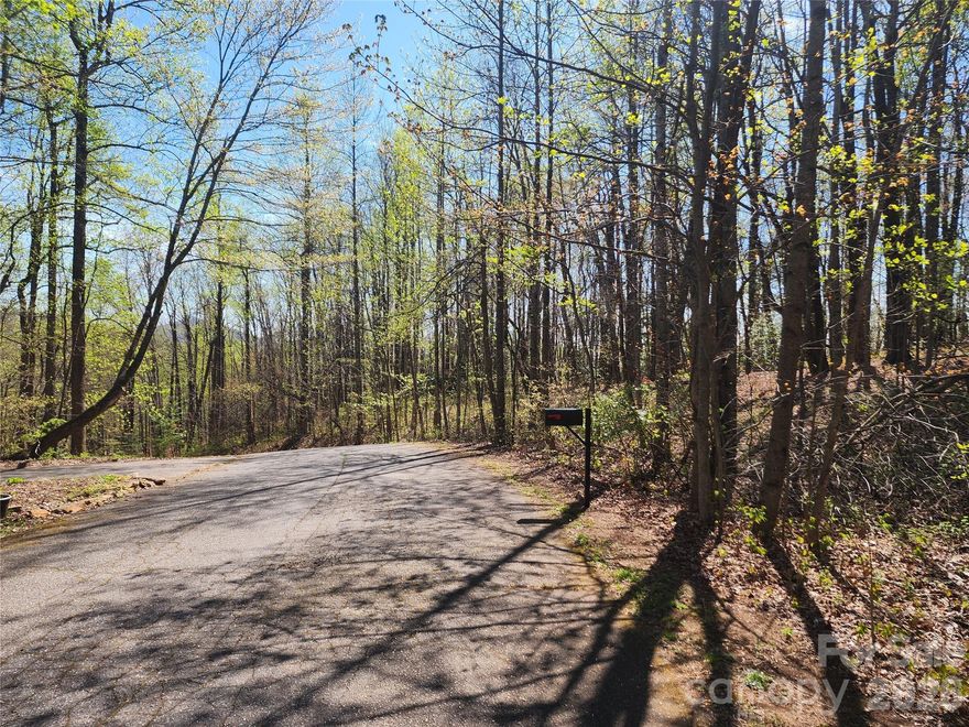 Discover the potential of Lots 7–10 in the established Antigua Subdivision, conveniently located off Brushy Mountain Road in Moravian Falls, NC. This unique offering includes four adjoining parcels totaling approximately 7.6 acres (+/-), providing flexibility for a variety of uses.

Whether you’re looking to build your dream mountain retreat or invest in a small development project, this property delivers. Create a single homesite with room to expand, guest quarters, or additional structures—all while enjoying beautiful long-range mountain views and the peaceful surroundings of Wilkes County. Alternatively, developers can take advantage of the existing subdivision layout and develop all four lots individually.

Positioned just a short drive from Wilkesboro and North Wilkesboro, you’ll have easy access to local dining, shopping, and year-round attractions. Enjoy nearby events like MerleFest, one of the premier bluegrass and Americana festivals in the country, or catch the excitement at the historic North Wilkesboro Speedway.

With a combination of natural beauty, location, and versatility, these Antigua Subdivision lots present a rare opportunity in the foothills of North Carolina.