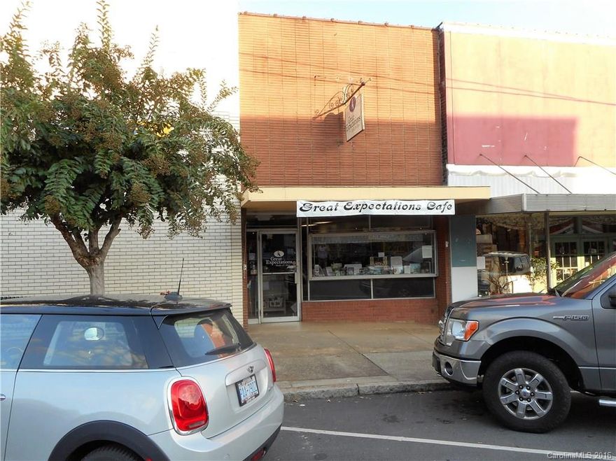 BACK ON MARKET 6/15/17! Downtown Rutherfordton location, close to Courthouse. Formerly Great Expectations Book Store & Café. Very versatile building with kitchen. 1,562 sq.ft. building in good condition w/full basement is suitable for a variety of uses. Past uses include Savings & Loan, Jewelry Store, pet store. Front entrance w/overhang & display window, built-in shelving, updated 1/2 bath, kitchen in rear (no equip just 3 separate sinks. Bsmt accessible from upstairs w/entrance off Taylor St.