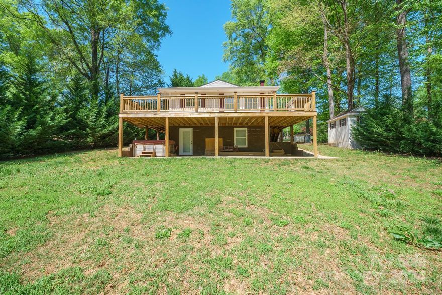 Experience lakeside living at its finest with this charming 3-bedroom, 2-bathroom waterfront home! Nestled on the shores of Lake Norman, the largest man-made lake in North Carolina, this property boasts a private floating dock and a nearly finished basement that only needs flooring to complete your ideal living space. Inside, you'll find spacious, well-lit bedrooms and modern bathrooms, and an open floorplan! While outside, the scenic views of the lake provide a perfect backdrop for relaxing evenings or entertaining guests. The area offers many recreational activities such as fishing, boating, and local trails. . Just 30 minutes north of Charlotte, this home offers a blend of peaceful waterfront living with convenient access to urban amenities, embodying the perfect balance of nature and city life.