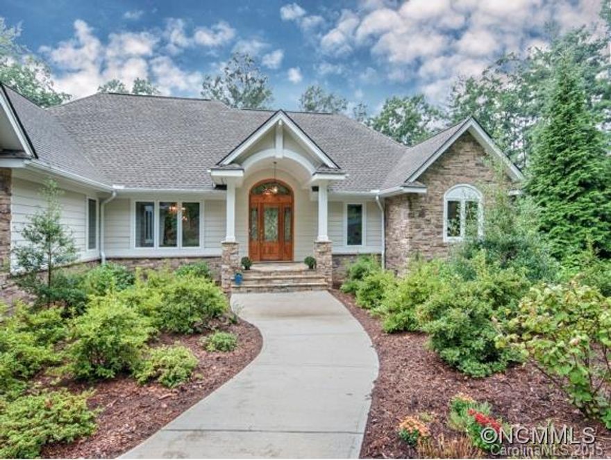 Builders own home offered in Kenmure Golf & Country Club with winter mtn & lake views.  Beautiful custom cabinetry, stone FP with built-ins, guest suite & master with outstanding bath on main plus office & den.  Exceptional eat-in kitchen with stainless appliances.  Open floor plan with access to carefree decks.  Lower level in-law suite - full kitchen guest suite, rec. room plus family room & extra bedroom.  Large workshop with easy access.