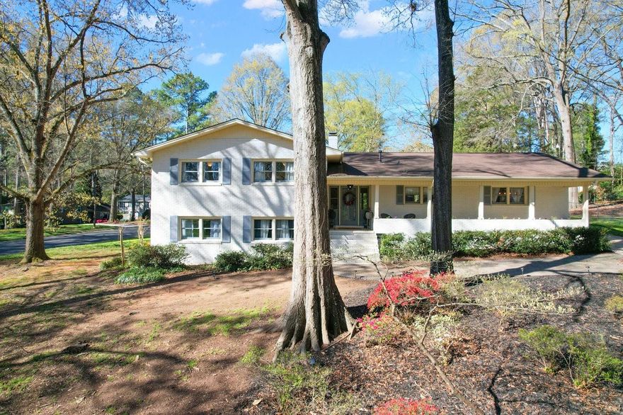 Welcome Home.  This home is nestled on a spacious over half acre lot with mature trees, landscaping, built in flower beds on the front porch including irrigation which also is installed in the entire yard.  This neighborhood is quiet, serene and desirable with wide walkable streets especially for kids! What we love about this home is the numerous places to entertain,  upstairs in the open floor plan with natural light or the huge finished lower level/basement and of course the amazing back patio.  The kitchen has stainless Steel Bosch Appliances and newer tankless water heater. Between the original hardwood floors both upper and lower, custom built in storage in all bedrooms it is hard to find a gem like this home.  Wait till you peek at the primary suite and bathroom; plenty of room!!
This home is a short drive to the growing Rock Hill Historic District 'Old Town",  close proximity to I77 to Charlotte and Columbia. You will not be disappointed in this one!