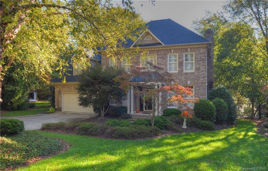 Wonderful, peaceful setting w/views of Lake Norman & walking distance to your deeded boat slip! Spacious full brick home w/ custom owner's suite on main. Kitchen has both granite and new quartz counters, tiled backsplash & 42" cabinets.  Huge screened in porch overlooks 2 large Koi ponds and professional landscaping!  Upstairs has 4 BR's including a 2nd Master.  Hardwood floors, plantation shutters, crown molding plus more make this a must see. Great location to highway, lake and restaurants!