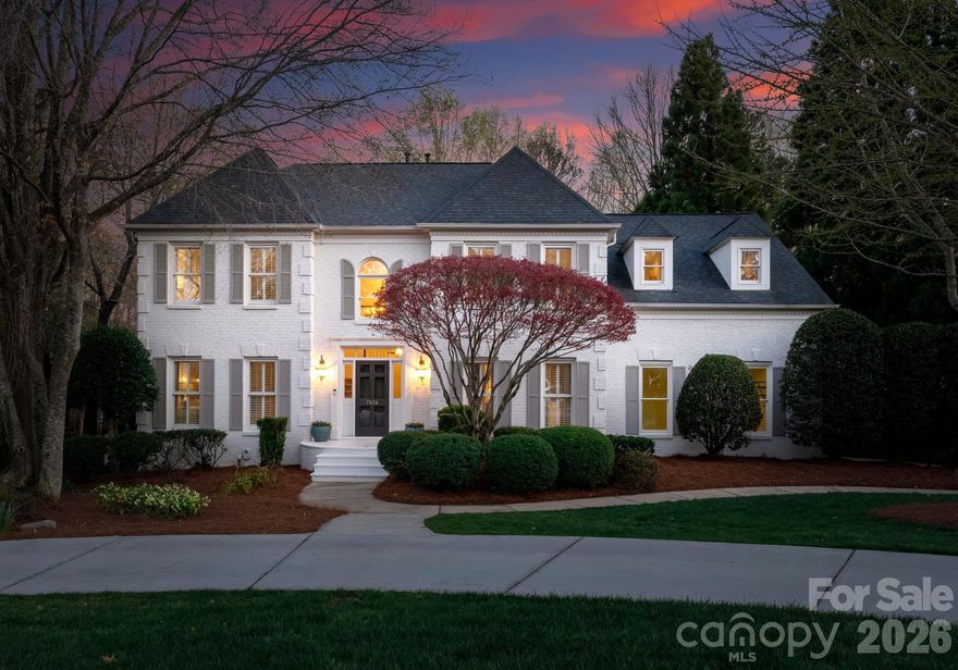 Tucked away on a picturesque corner lot in the highly desirable Preserve at Belingrath community, this elegant residence offers a refined blend of timeless architecture, updated finishes, and expansive living spaces. Spanning over 5,600 square feet across three beautifully finished levels, the home showcases crown molding throughout, designer lighting, and thoughtfully curated architectural details.

A grand two-story foyer creates a striking first impression, opening to warm, inviting spaces including a formal dining room and a sophisticated sitting room. The main living area is centered around a beautiful brick fireplace, creating a natural gathering space. The kitchen serves as the heart of the home, featuring floor-to-ceiling custom cabinetry, an oversized island, premium appliances, under-cabinet lighting, and a well-appointed butler’s pantry with wine display and walk-in storage. The adjacent breakfast area and living spaces flow seamlessly to the screened porch and outdoor patio for effortless indoor-outdoor living.

Upstairs, the primary suite offers a private retreat with a tray ceiling, custom built-ins, dual walk-in closets, and a spacious bath with dual vanities and an expansive tiled shower. Three additional bedrooms, including a guest suite with an ensuite bath, provide flexibility, while a versatile bonus room is ideal for a media room, playroom, fitness space, or home office.

The finished lower level is a standout, offering an exceptional extension of living and entertaining space. It features multiple gathering areas, a full bar with cabinetry and refrigeration, built-in shelving, and a dedicated entertainment area, along with a private guest bedroom, full bathroom, and flexible space for a home office, gym, or lounge. With direct access to the backyard, this level seamlessly connects indoor and outdoor living.

Outdoor living is equally impressive, with a screened porch, multiple patios, and a beautifully landscaped, fully fenced backyard. The tiered yard design, mature trees, and stone accents create a sense of privacy and character, while the included playset with slides and swings adds a functional and inviting space for recreation. 

Additional highlights include a circular driveway addition, a two-car garage with built-in storage and a ChargePoint EV charger, and well-designed drop zone and laundry areas. Recent upgrades include extensively refreshed paint, new lighting, updated appliances, and a tankless water heater.

Located in a welcoming, established neighborhood known for its friendly atmosphere and tree-lined streets, this home offers a true sense of community. Just minutes from SouthPark, enjoy premier shopping, dining, and everyday conveniences, along with easy access to major roadways, Uptown Charlotte, top-rated public and private schools, and nearby parks.