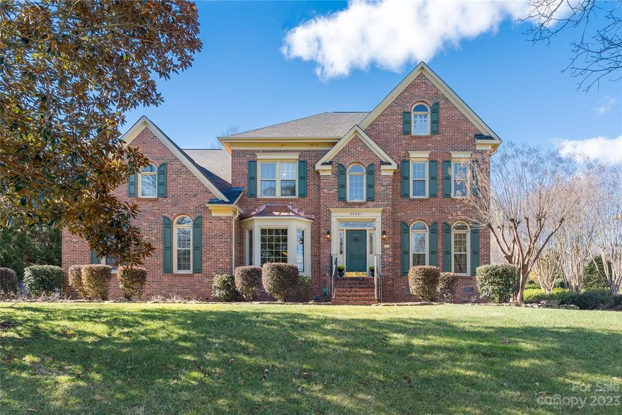 Spacious 2-story full brick home with DEEDED BOAT SLIP ON LAKE NORMAN! Nice terraced backyard with trees and a fence. Wonderful kitchen with gas stove top, island, stainless appliances and walk in pantry. Oversized patio with built in grill for enjoying meals outside or walk down and jump on your boat to enjoy an evening cruise to one of several restaurants in the area.  Beautiful outdoor lighting in the yard. All bedrooms are spacious. Updates in 2023 include new roof, upstairs AC and downstairs Heat system. Enjoy all Cornelius and Lake Norman have to offer.