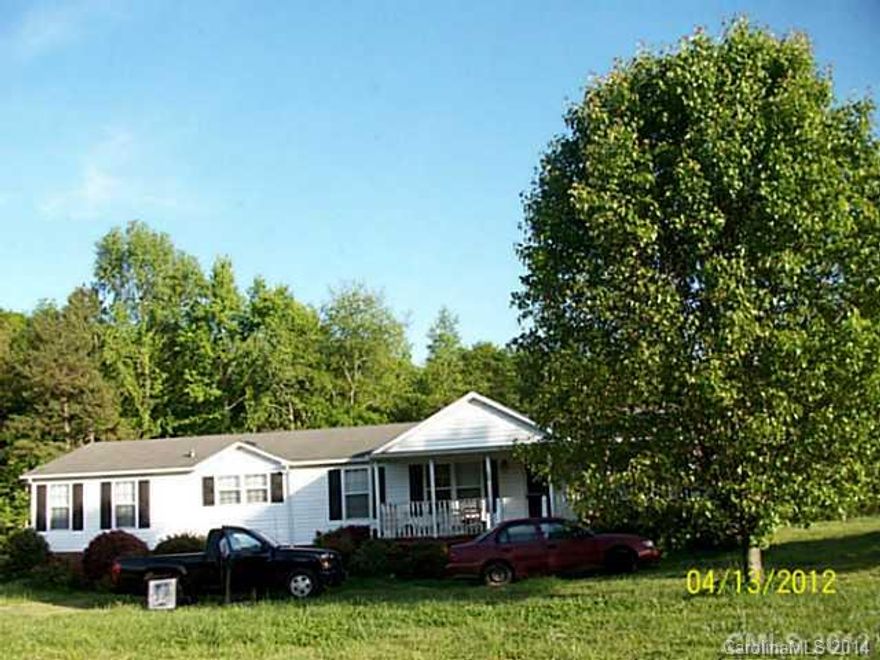 Seller will remove handicap ramp from property at Buyer's request. Outbuilding is wired and connecting wiring is in pvc pipe underground. Split bedroom plan. Rocking chair front porch. Deck on  back. Mstr Bdrm features a parents retreat or home office  and bath with garden tub plus seperate shower. The 2 car carport is detached.